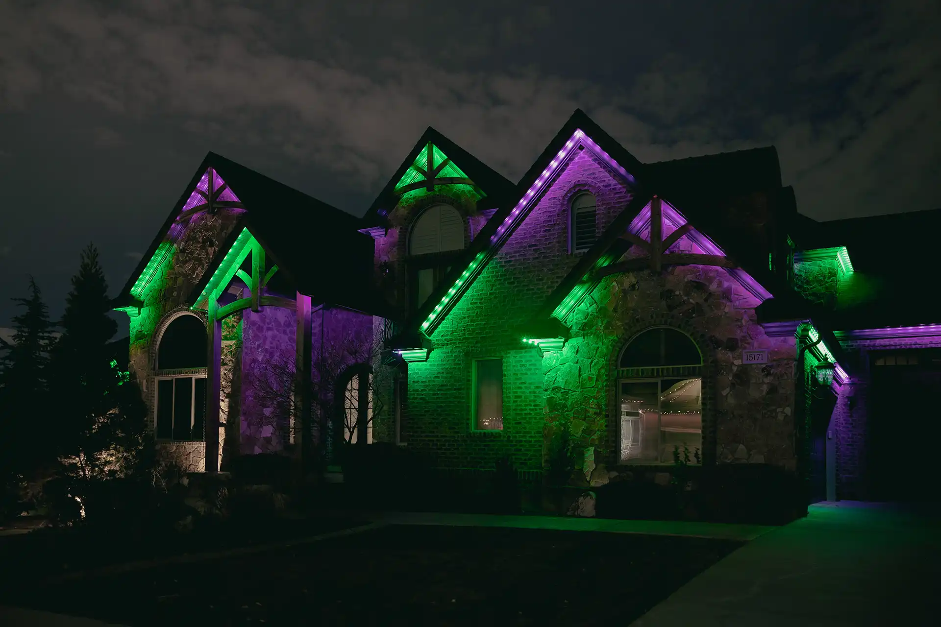 professional downward-facing LEDs illuminating a Plano home at night